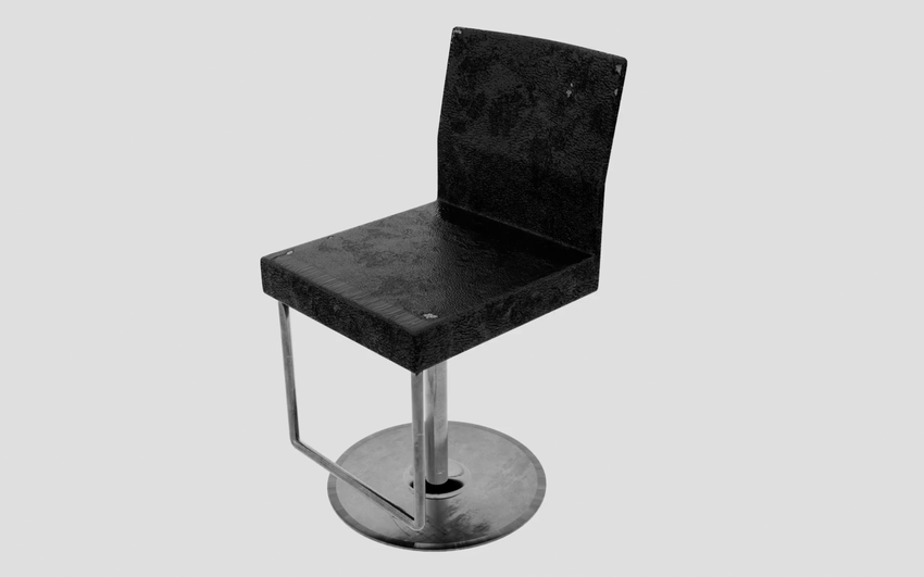 A black leather chair with a metal base is rendered against a white background.